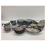Decorative China Set with Floral and Scenic Motifs