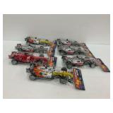 Seven Formula 1 Race Car Toys in Packaging