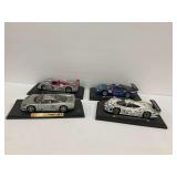 Four Maisto Racing Car Models: Audi, Mercedes, Porsche