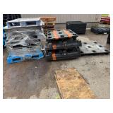 Three Stacks of Assorted Plastic Pallets
