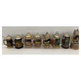 Collection of Decorative Ceramic Beer Steins with Pewter Lids