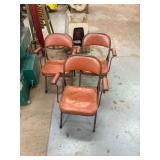 Three Cushioned Orange Folding Chairs ... 30 Inches tall.