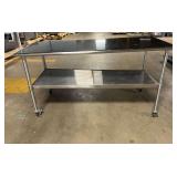 Stainless Steel Rolling Table ... 38 x 72 x 30 Inches ... One leg is bent making the table uneven SEE PHOTOS