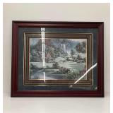 Framed Landscape Print of a House by a Waterfall