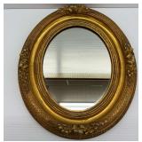 Gilt Framed Oval Wall Mirror with Decorative Detail