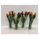 Four Decorative Floral Arrangements in Glass Vases