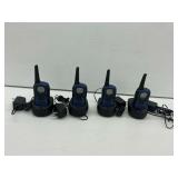 Four Uniden Walkie Talkies with Charging Docks... work