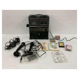 The Singing Works Karaoke Music System with Tapes & Microphones, powers on