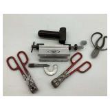 Various Tools Including Micrometer and Arbor Press