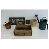 Decorative Collectible Items Including Sign, Watering Can, and Crock