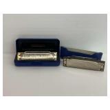Two Hohner Harmonicas