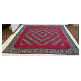 Red and Floral Patterned Quilt