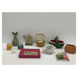 Eleven Decorative Items Including Candles, Wooden Rabbit Figures, and Bowls