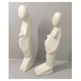 Two Stylized Human Figure Statues