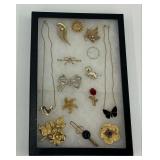 Brooches and Necklaces in Case