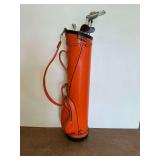 Orange Golf Bag with Various Golf Clubs