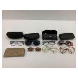 Eyeglasses, Sunglasses, and Several Cases