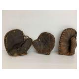 Three Leather Baseball Mitts