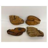 Four Baseball Catchers Mitts