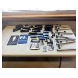 Office Supply Assortment: Staplers, Calculators, and Signage