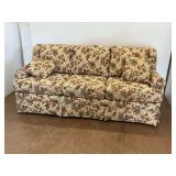 Floral Upholstered Sofa with Two Throw Pillows