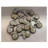 Sixteen 4 in. Gray Swivel Casters with Locking Mechanisms