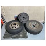 2 Tires Mounted on Steel Rims and 1 Spare Steel Rim