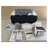 Medical Supplies Including Dermacea Abdominal Pads, McGrath Mac Laryngoscope Blades, and Physio-Control Lucas Accessories in Storage Tote