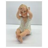 Ceramic Figurine of Sitting Child