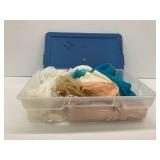 Textiles and Garments in Plastic Storage Bin