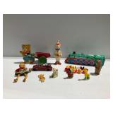 Vintage Toys Including Tin Train, Wooden Pull Toy, and Rubber Figures