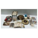 Sewing and Craft Items Including Spools of Thread, Patterns, and Buttons