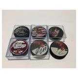 (6) Signed Rockford IceHogs Hockey Pucks with Certificates