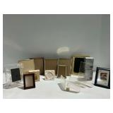 Group of Picture Frames and Clear Plastic Display Stands