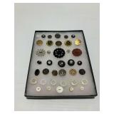 Display Case with Decorative Garment Buttons