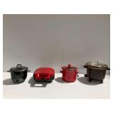 Aroma Rice Cooker, Ginny's Pie Maker, and (2) Slow Cookers... all power on