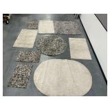 Group of Rugs with Various Patterns and Shapes... need cleaning