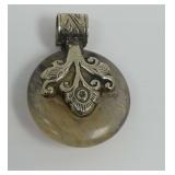 Pendant with Round Patterned Stone and Ornate Metal Bail