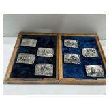 (8) Siskiyou Buckle Co. Charles M. Russell Belt Buckles with (2) Wooden Display Cases