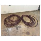 Two Coils of Heavy-Duty Red Rubber Industrial Hose with Brass Fittings