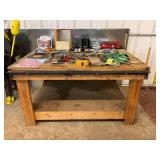 Heavy-Duty Wooden Workbench with Lower Storage Shelf and Integrated Electrical Outlets..35x63x50