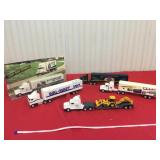 Set a five toy tractor trailers, 1/64 scale