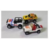 Three Toy Jeep and Truck Models