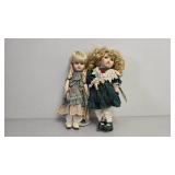 Four Porcelain Dolls with Clothing