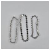Three Silver-Tone Bracelets