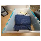 Plastic Storage Bin With Clothing Items