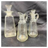 Three Clear Glass Cruets With Stoppers