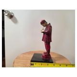 Red Painted Figurine on Black Base