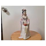 Porcelain Figurine of Seated Woman