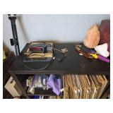 Black Wooden Shelving Unit with Contents